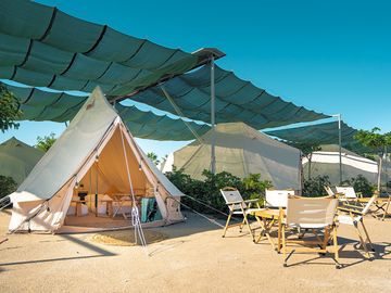 Tents under a shade