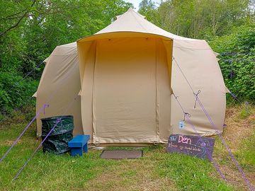 Yurt set in its own private space with benches and stone firepit